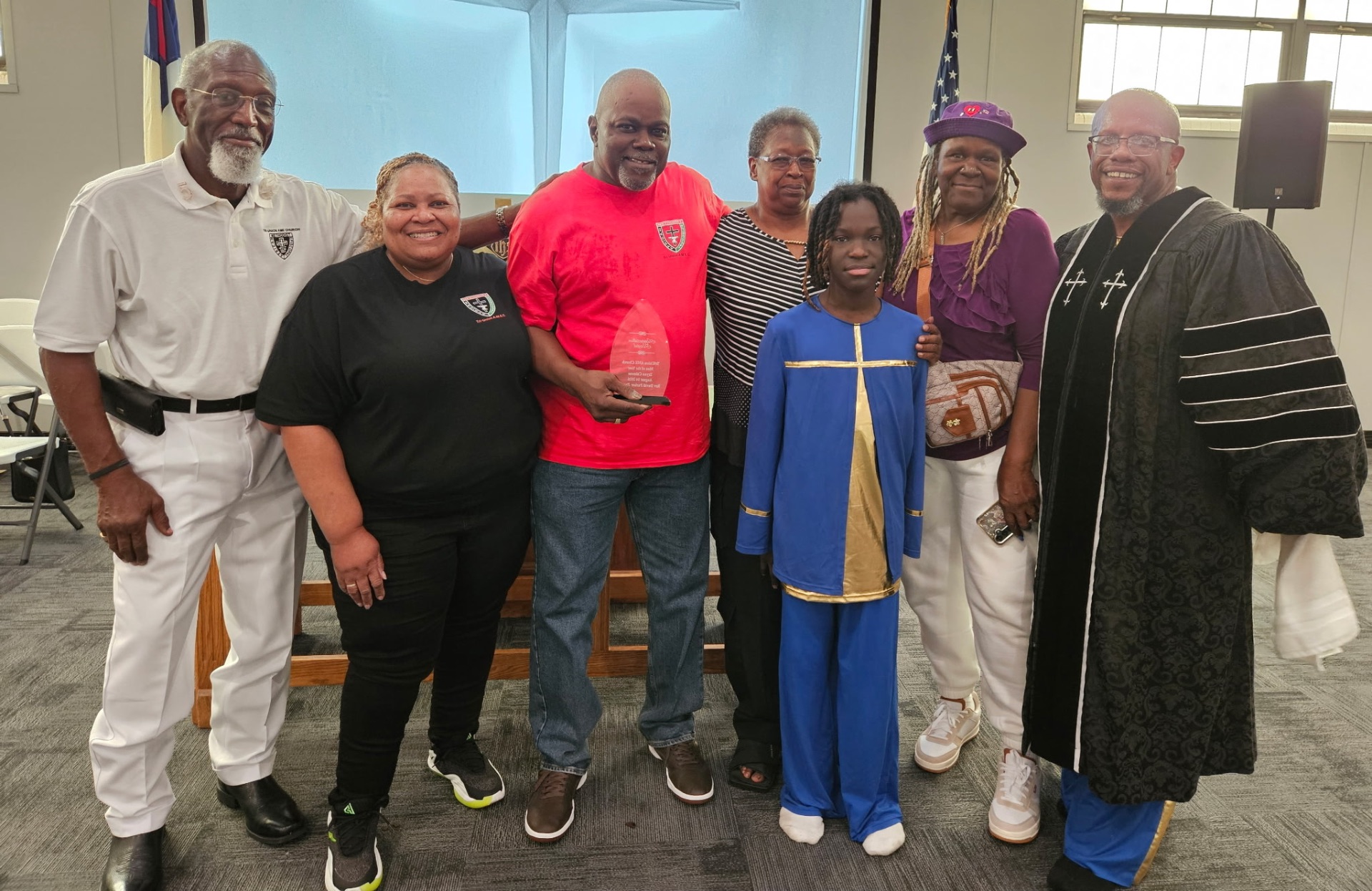 Man of the Year with family, church leaders, and Rev. David Parker